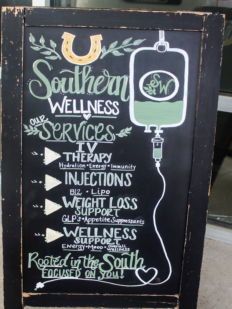 Southern Wellness Clinic sidewalk chalkboard sign listing services